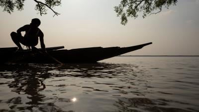 Silhouette of fisherman and boat