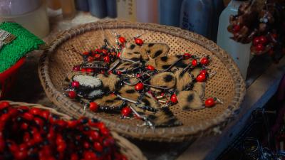 Bowl of Jaguar fur earrings sold at a markets