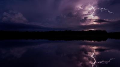 Lightning storm reflecting in river in the Amazon basin, Yasuni National Park, Orellana, Ecuador flipped