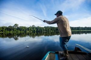 Segundo fishes for Pirana on lake Sandoval, the Amazon