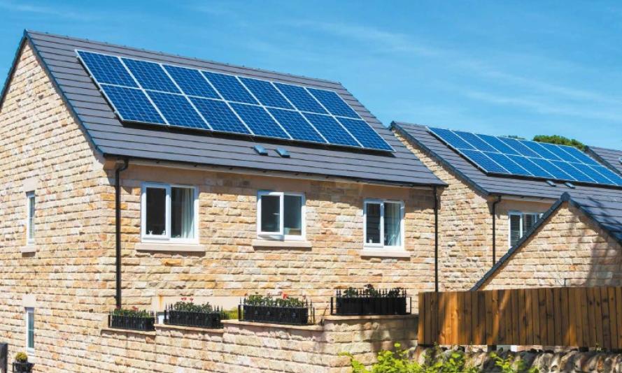 Cover image of Filling The Gap summary report. Image of new build homes with solar panels on the roofs