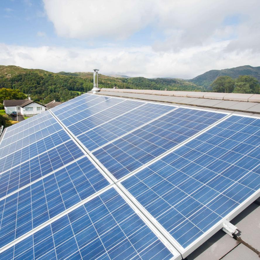 Close up of solar voltaic panels on a house roof in Ambleside, Cumbria, UK