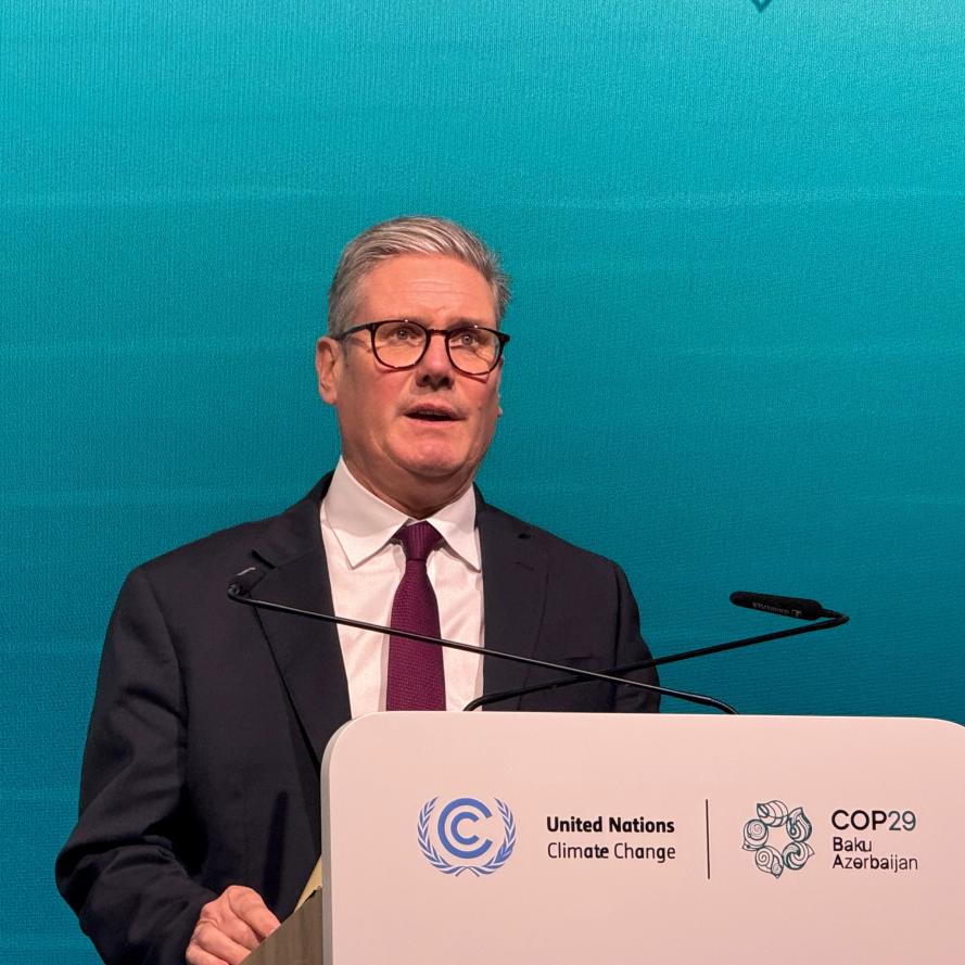 Keir Starmer at podium at COP29 climate talks press briefing