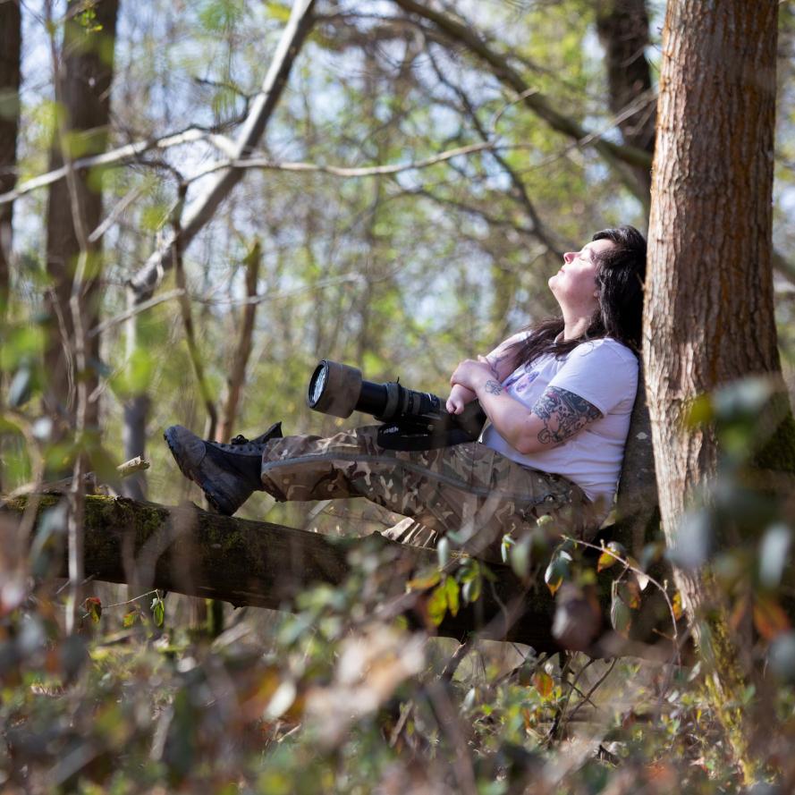 Jen Read, wildlife photographer, forest bathing and engaging her senses in ancient woodland. © Suzie Hubbard / WWF-UK