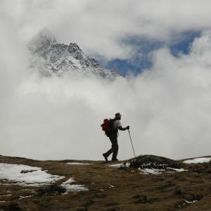 A lone trekker on a trail in the Himalayas near Mount Everest, Nepal.