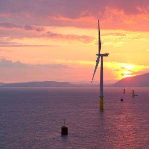 Coastal wind farm at sunset reversed