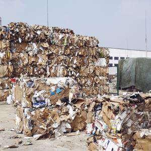 Raw Material Yard. Bails of cardboard before they are separated and recycled down. Zao Zhuang Hua Run Paper Co., Ltd, China.