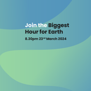 A blue and green gradient background with curved shaped. Text reads, 'Join the Biggest Hour for Earth. 8.30pm 23rd March 2024'.