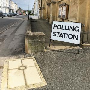 Polling station sign on street