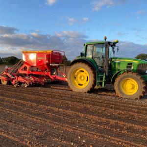 Tractor harvesting a field 