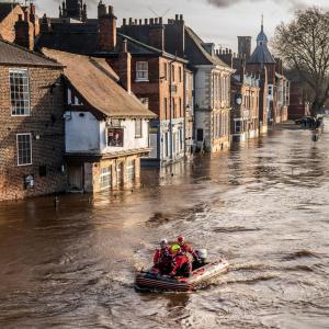 Rescue workers in boats in the centre of York after the River Ouse burst its banks