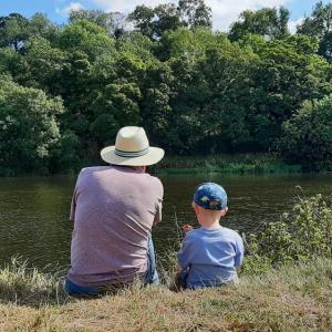 Grandpa and Grandson take a moment by a river Nottinghamshire