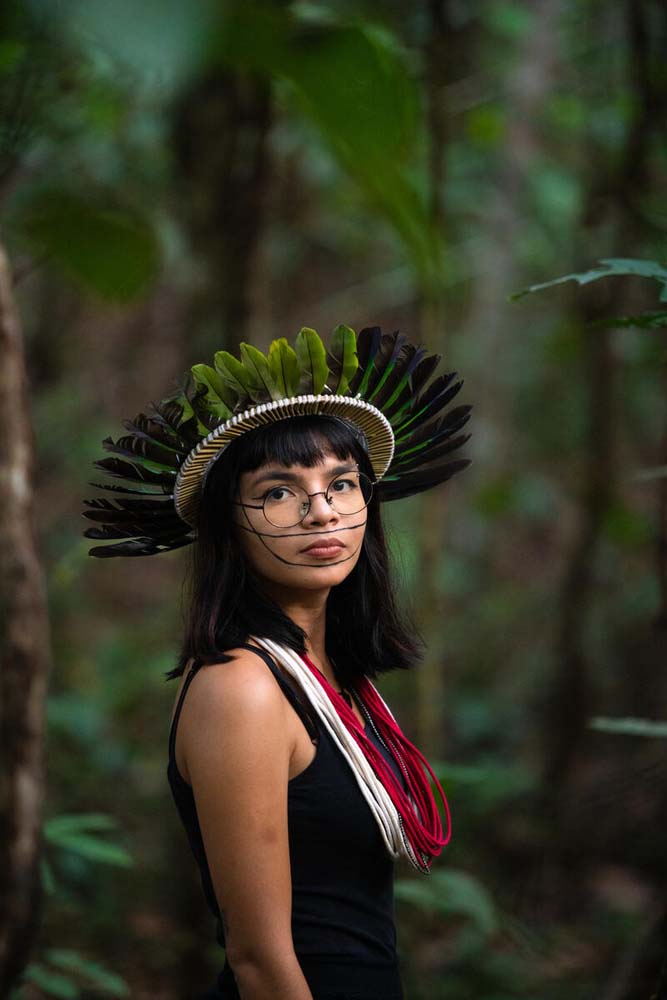 Walelasoetxeige Paiter Bandeira Suruí, known as Txai Suruí, 24 years old, lives in Rondônia, Brazil, and is part of the Deliberative Council of the Kanindé Ethno-Environmental Defense Association. Daughter of the chief Almir Suruí and the indigenist Ivaneide Bandeira Cardozo, Walela Txai Suruí is an youth activist and law student who came to represent her people at the UN Climate Conference - COP25, in Madrid. She is also a young representative of the Guardians of the Forest, an alliance of communities that protects tropical forests around the world. © Mboakara Uru-eu-wau-wau / Kanindé 
