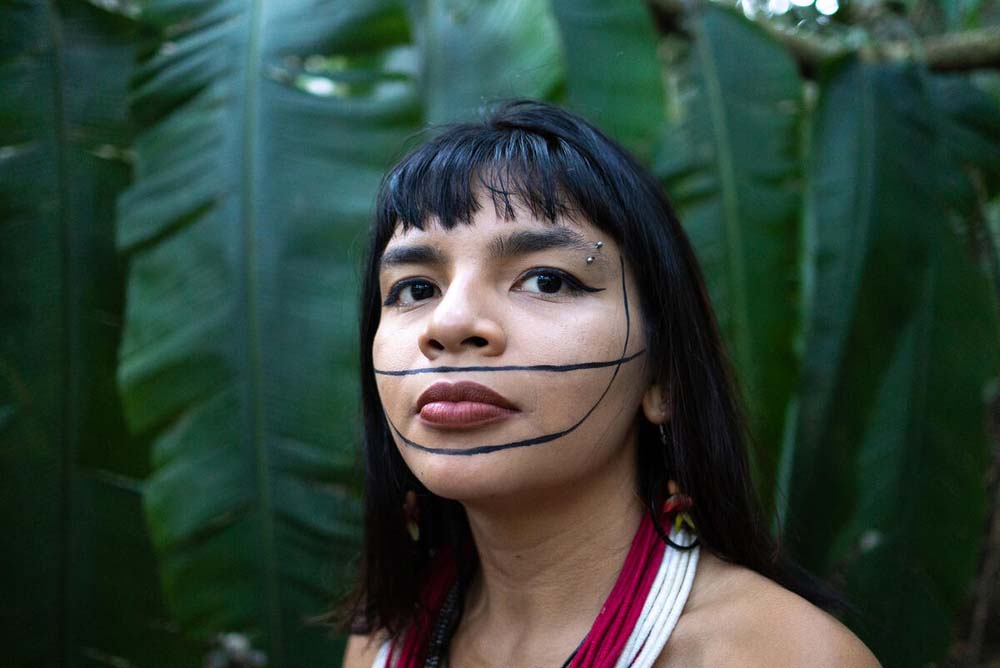 Walelasoetxeige Paiter Bandeira Suruí, known as Txai Suruí, 24 years old, lives in Rondônia, Brazil, and is part of the Deliberative Council of the Kanindé Ethno-Environmental Defense Association. Daughter of the chief Almir Suruí and the indigenist Ivaneide Bandeira Cardozo, Walela Txai Suruí is an youth activist and law student who came to represent her people at the UN Climate Conference - COP25, in Madrid. She is also a young representative of the Guardians of the Forest, an alliance of communities that protects tropical forests around the world. © Mboakara Uru-eu-wau-wau / Kanindé 