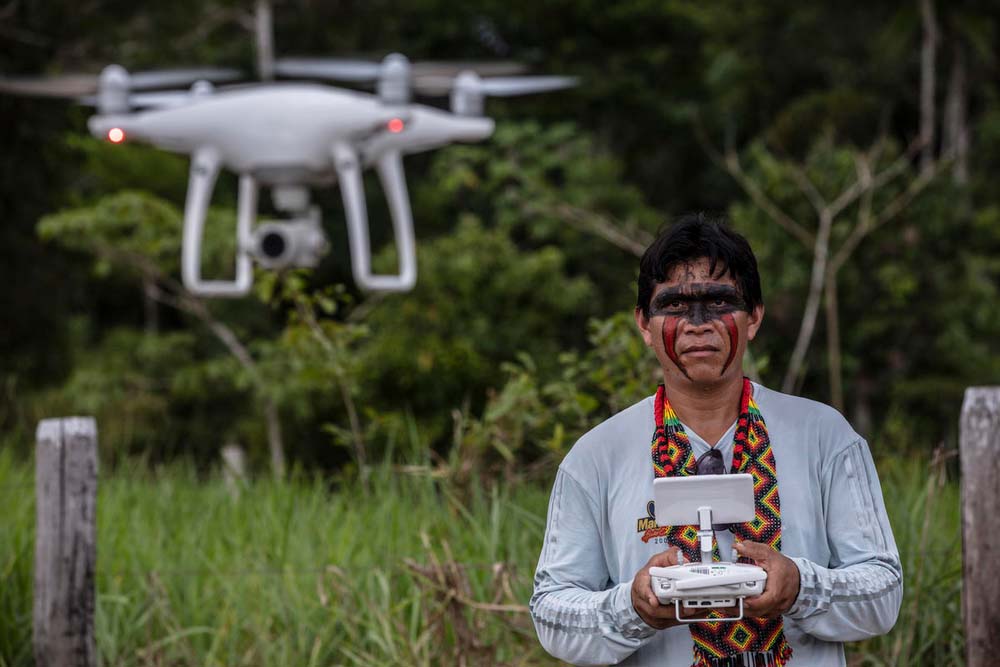 WWF providing drone training to communities. Flying the drone is Ismael Menezes Brandão (Siã Shanenawa) from Comissão Pró-Índio (CPI). Porto Velho, Rondônia, Brazil. © Marizilda Cruppe